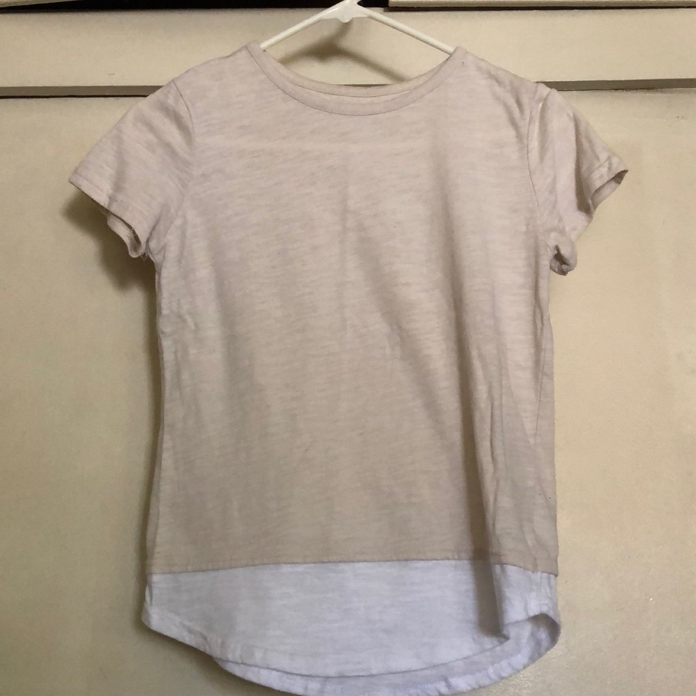 A beige cream colored high-low top.